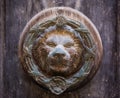 Old rusty iron lion head door knocker on a wooden door. Mdina, Malta Royalty Free Stock Photo