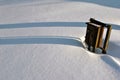 Old rusty iron mail or electricity box in white snow background with long shadows Royalty Free Stock Photo