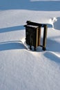 Old rusty iron mail or electricity box in white snow background with long shadows Royalty Free Stock Photo