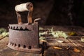 Old rusty iron on a rustic wooden table. Ironing Royalty Free Stock Photo