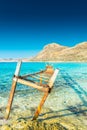 Old rusty jetty on the amazing crystal clear water of Balos Lagoon, Crete,  Greece Royalty Free Stock Photo