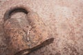 Old rusty key and lock. Vintage door padlock with key. Antique key on weathered background. Security and safety concept. Royalty Free Stock Photo