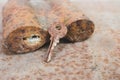 Old rusty key and lock. Vintage door padlock with key. Antique key on weathered background. Security and safety concept. Royalty Free Stock Photo