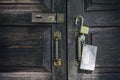 Old rusty and key locks on wooden door Royalty Free Stock Photo