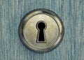 Old rusty keyhole on a wooden door Royalty Free Stock Photo