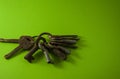 Old rusty keys on green background Royalty Free Stock Photo