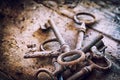 Old rusty keys on a wooden table Royalty Free Stock Photo