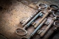 Old rusty keys on a wooden table Royalty Free Stock Photo