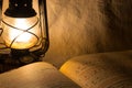 Old rusty lantern and a book