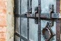 old and rusty latch and handle on metal door. old castle, house, basement Royalty Free Stock Photo