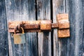 Old rusty latch with padlock on doors Royalty Free Stock Photo