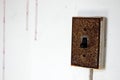 Old rusty light switch in interior of abandoned hospital building