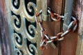 Old Rusty Lock and Chain On Weathered Patina Copper Door of Cemetery Graveyard Mausoleum Memorial Royalty Free Stock Photo