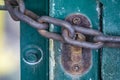Old and rusty lock and thick chain Royalty Free Stock Photo