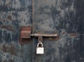 Old rusty locked metal gate. Royalty Free Stock Photo