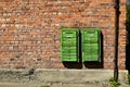 Old rusty mail boxes on brick wall Royalty Free Stock Photo