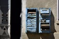 Old rusty broken mailboxes on the wall Royalty Free Stock Photo