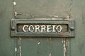 Old rusty mailbox with the word correio Royalty Free Stock Photo