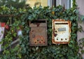 Old rusty mailboxes with ivy