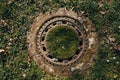 Old rusty manhole covered with grass Royalty Free Stock Photo