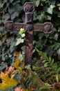 Old rusty memorial cross at cemetery. Royalty Free Stock Photo