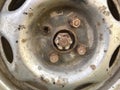 Old rusty metal alloy wheel car Royalty Free Stock Photo