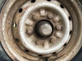 Old rusty metal alloy wheel car Royalty Free Stock Photo