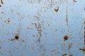 An old rusty metal background. A metallic blue background with traces of scri net, rust and wiped paint Royalty Free Stock Photo
