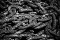Old rusty metal chains with large links in a port Royalty Free Stock Photo