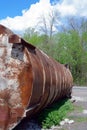 Old rusty metal construction near the road. Abandoned tank. Crisis concept Royalty Free Stock Photo