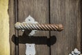 Old rusty metal door handle on wood door in Wurzburg, Germany Royalty Free Stock Photo