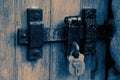 Old rusty metal door latch and padlock Royalty Free Stock Photo