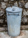 Old rusty metal garbage bin