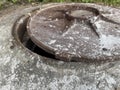 Old rusty metal hatch on concrete Royalty Free Stock Photo