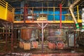 Old rusty metal iron abandoned bad in corrosion equipment heat exchangers pipes pumps at an industrial refinery chemical Royalty Free Stock Photo