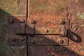 Old rusty metal latch on metal door Royalty Free Stock Photo