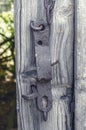 Old rusty metal latch on wooden door Royalty Free Stock Photo