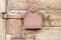 Old rusty metal latch on wooden doors Royalty Free Stock Photo