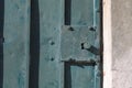 Old rusty metal lock and keyhole on a old iron door as a beautiful vintage background. Old rusty green gate Royalty Free Stock Photo