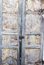 Old rusty metal lock and keyhole on a old metal rusty and wood door as a beautiful vintage background Royalty Free Stock Photo