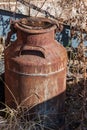 Old rusty metal milk jug, rusty jug Royalty Free Stock Photo