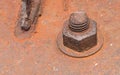 Old rusty metal nut locked with rust and corrosion old bolts. Royalty Free Stock Photo