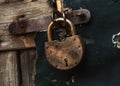 Old rusty metal padlock on door Royalty Free Stock Photo