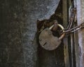 Old rusty metal padlock on a door Royalty Free Stock Photo