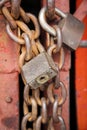 Old rusty metal padlocks on chains