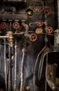 Old rusty metal parts of an antique steam engine locomotive Royalty Free Stock Photo