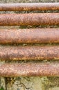 Old rusty metal pipe on cement wall Royalty Free Stock Photo