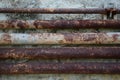 Old rusty metal pipe on cement wall Royalty Free Stock Photo