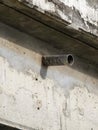 old rusty metal pipe on cement wall Royalty Free Stock Photo
