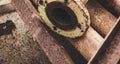 Old rusty metal pipe connection. Scrap metal - predominantly ferrous metals. Waste from industry Royalty Free Stock Photo